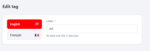 The React tag editor — a language switch (English / Français) and the per-language "LABEL" field with the "At least one title is required" hint